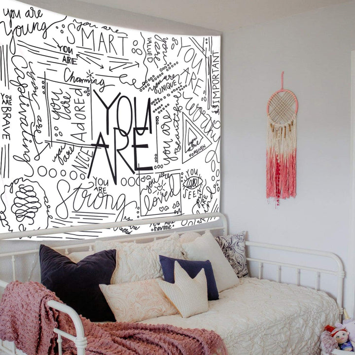 VibeCore Positive You Are Tapestry On Wall Behind Bed
