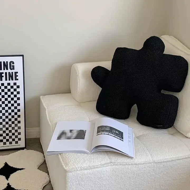 VibeCore Puzzle Piece Decorative Pillow in black, featuring a quirky puzzle piece shape made from plush fabric and filled with PP cotton for cozy comfort. A bold and playful addition to any room, perfect for your bed, couch, or cozy nook.