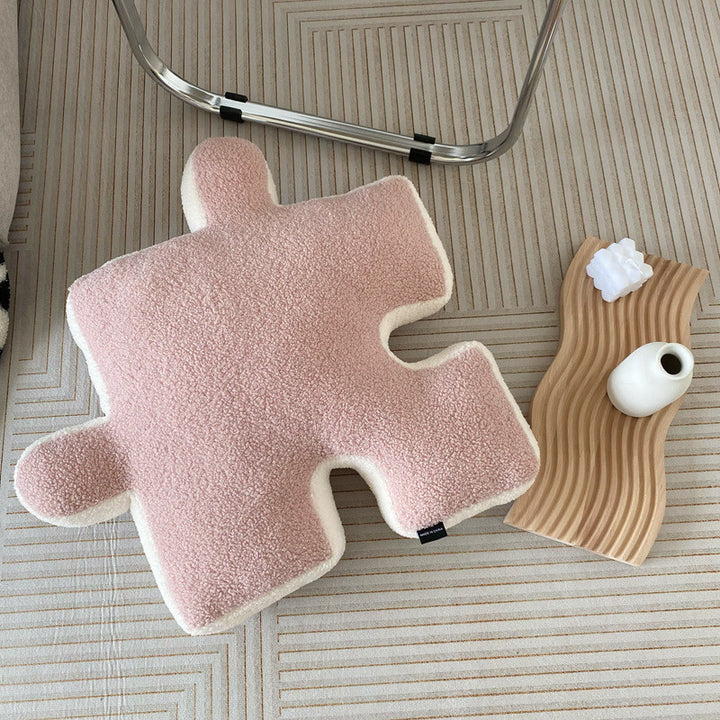 VibeCore Puzzle Piece Decorative Pillow in light pink, featuring a playful puzzle piece shape made from plush fabric and filled with PP cotton for cozy comfort. A fun, bold accent that adds a quirky touch to your bed, couch, or cozy nook.