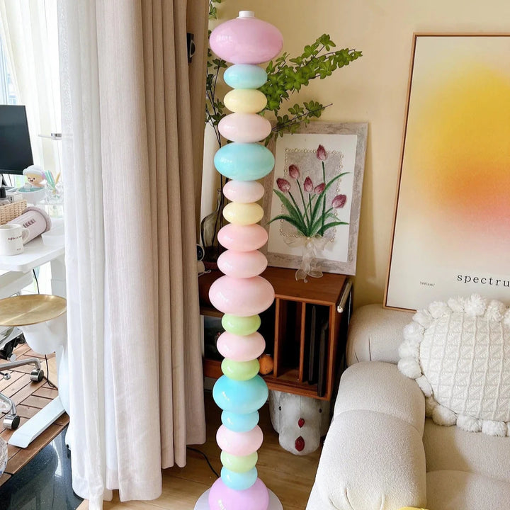 VibeCore Rainbow Candy Floor Lamp Closeup In Aesthetic Living Room – Close-up of a colorful, candy-inspired floor lamp with a metal base in an aesthetic living room. The vibrant glass beads create a playful, eye-catching design.