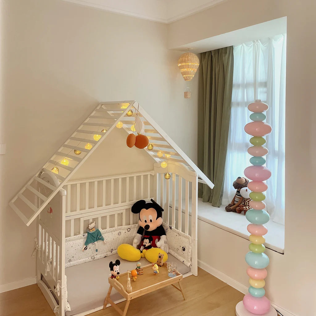 VibeCore Rainbow Candy Floor Lamp In Baby's Room – The colorful Rainbow Candy Floor Lamp illuminating a baby's room, with its playful and bright design adding a fun and whimsical touch to the space, perfect for a cozy, cheerful atmosphere.