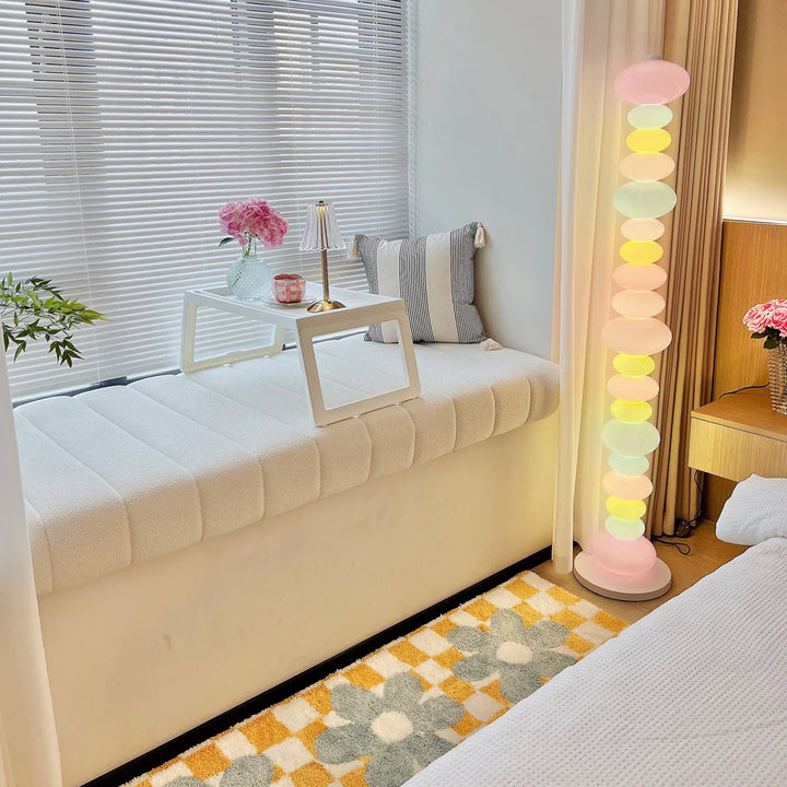 VibeCore Rainbow Candy Floor Lamp In Bedroom – The Rainbow Candy Floor Lamp illuminating a cozy bedroom, adding a pop of color and charm with its playful, candy-inspired design and soft, adjustable lighting.
