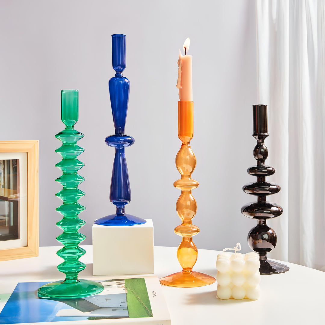 VibeCore Retro Abstract Glass Candle Holders in green blue orange and black displayed together highlighting their unique geometric shapes and modern glass aesthetic.