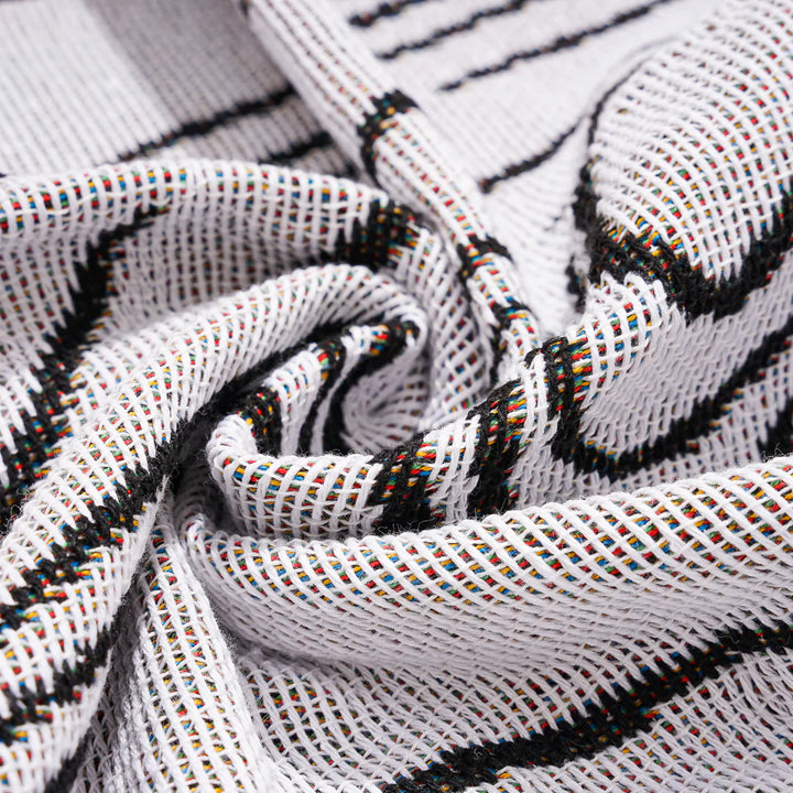 VibeCore Retro Marble Wave Woven Blanket material close-up, showcasing soft 100% combed cotton texture and vibrant, spiritual-inspired design.