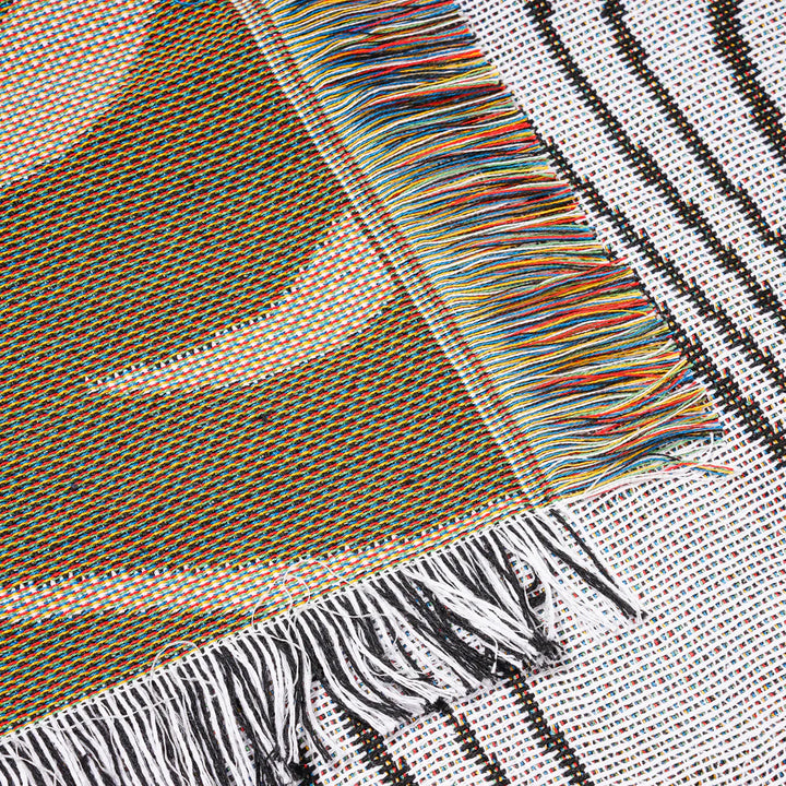 VibeCore Retro Marble Wave Woven Blanket reversible side close-up, alternative angle, highlighting vibrant cosmic design and soft 100% combed cotton texture.