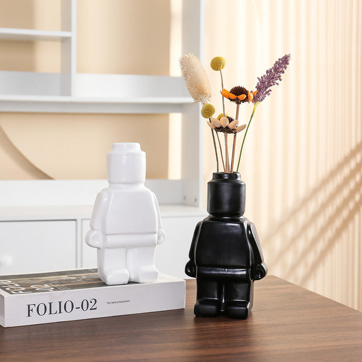 Aesthetic robot vases in black and white featuring sleek minimalist designs with pop-culture influence perfect for adding bold artistic touches to shelves, tables, or modern home decor.