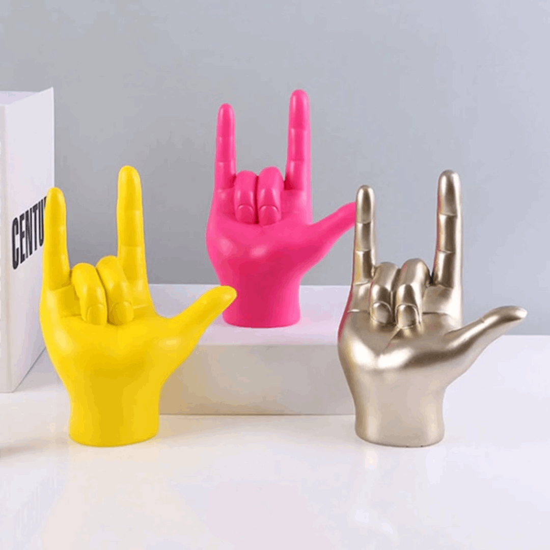 VibeCore Rock On Hand Sculpture in all 3 colors (yellow, pink, champagne), featuring bold hand gestures in resin, perfect for adding playful and vibrant decor to any space. Ideal for music lovers.