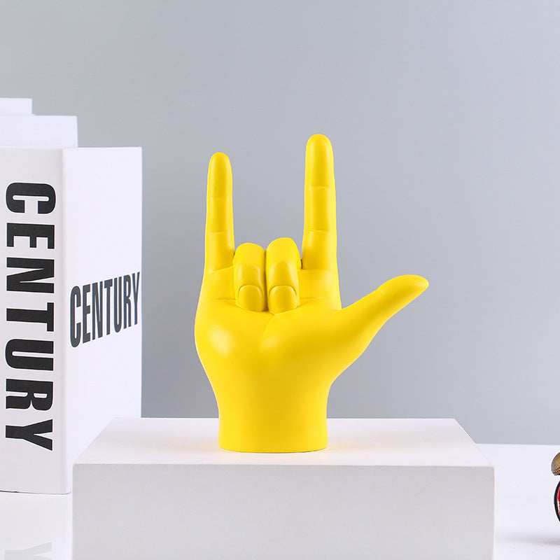 VibeCore Rock On Hand Sculpture in yellow, a playful resin piece featuring a bold hand gesture. Perfect for adding fun, modern decor to shelves, desks, or coffee tables. Ideal gift for music lovers.