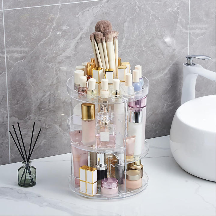 VibeCore Rotating Clear Makeup Organizer in a bathroom setting. Durable acrylic design with 360-degree rotation. Sleek makeup holder ideal for organizing brushes, cosmetics, and skincare. Features adjustable tiers for versatile storage, perfect for vanities or countertops. A functional and stylish cosmetic organizer for modern bathroom decor.