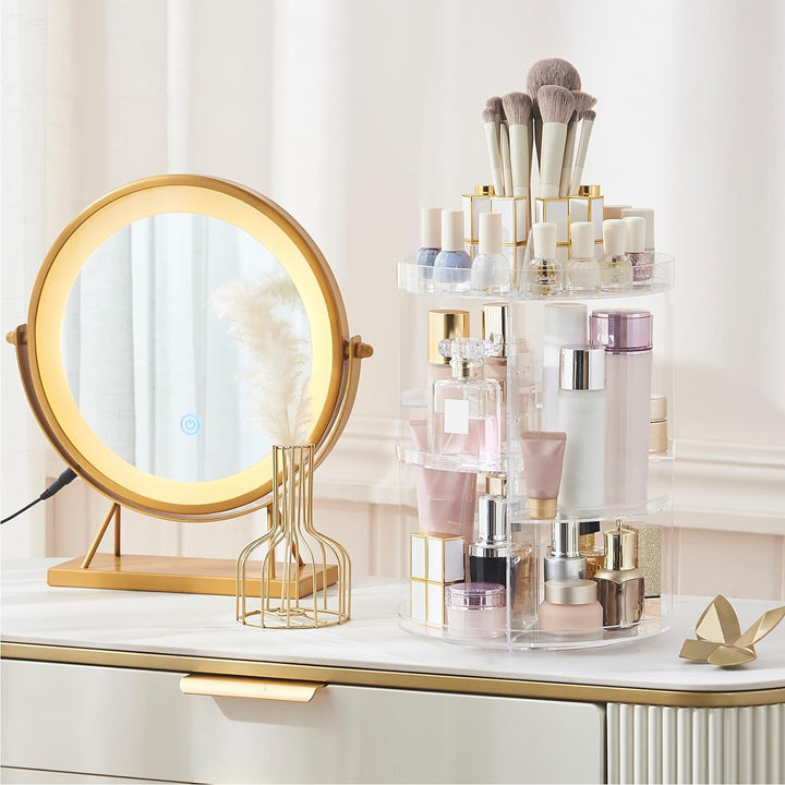 VibeCore Rotating Clear Makeup Organizer on a vanity. Stylish clear acrylic design with 360-degree rotation, adjustable tiers, and spacious compartments for cosmetics and brushes.