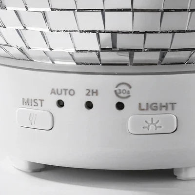 VibeCore Rotating Disco Ball Diffuser showcasing its easy-to-use buttons for controlling the mist, rotation, and light settings.