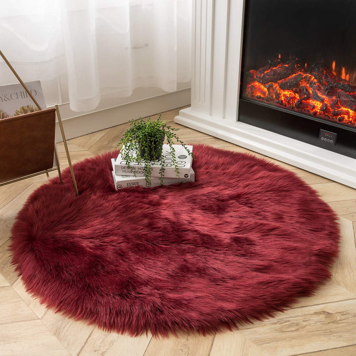 VibeCore Round Faux Fur Accent Rug in red on the floor. Soft, fluffy texture with a non-slip backing, perfect for bedrooms, living rooms, or dorm rooms. Easy to clean, available in multiple colors.