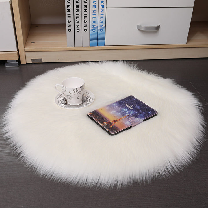 The VibeCore Round Faux Fur Accent Rug in White, showcasing its plush, soft faux fur texture and sleek round shape, adding a cozy and luxurious touch to any space. Perfect for living rooms, bedrooms, or dorms.