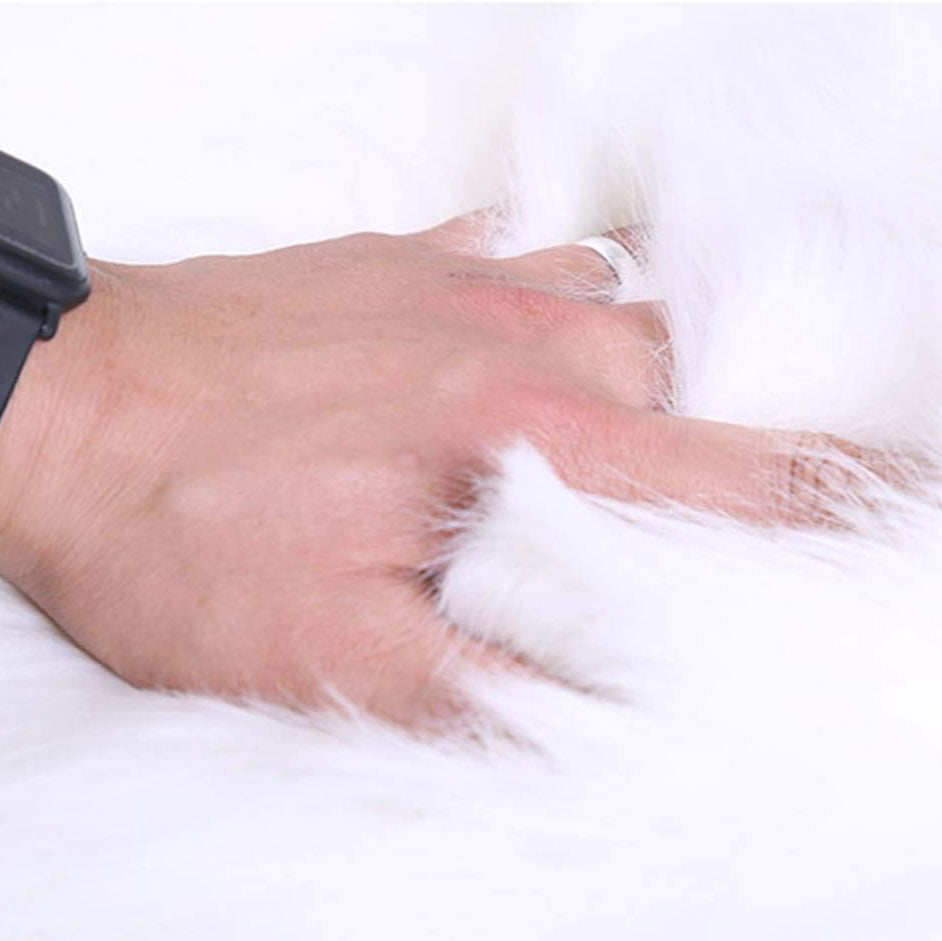 The VibeCore Round Faux Fur Accent Rug in White, highlighting its plush, soft texture that adds comfort and a luxurious touch to any room. Ideal for creating a cozy atmosphere in living rooms, bedrooms, or dorms.