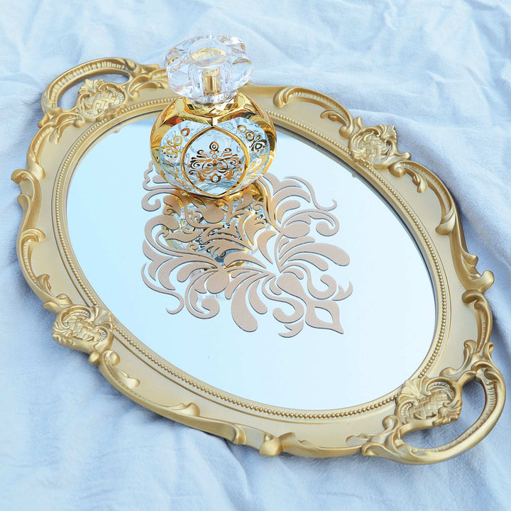 VibeCore Round Royal Mirror Tray in Gold with a Gold Design in the Center, featuring an elegant resin-crafted design. Ideal for organizing perfumes, jewelry, or decor, adding a luxurious European charm to any surface.
