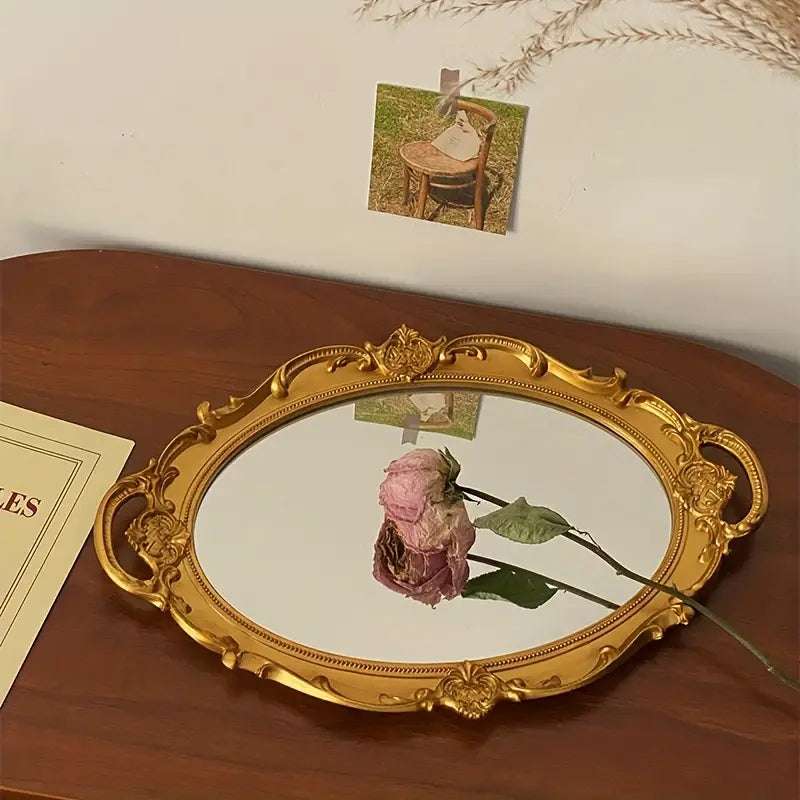 VibeCore Round Royal Mirror Tray in Gold, featuring a dried rose, showcasing its elegant resin-crafted design. Perfect for organizing jewelry, perfumes, or decor, adding European charm and a refined accent to any surface. Ideal for display or as a thoughtful gift.