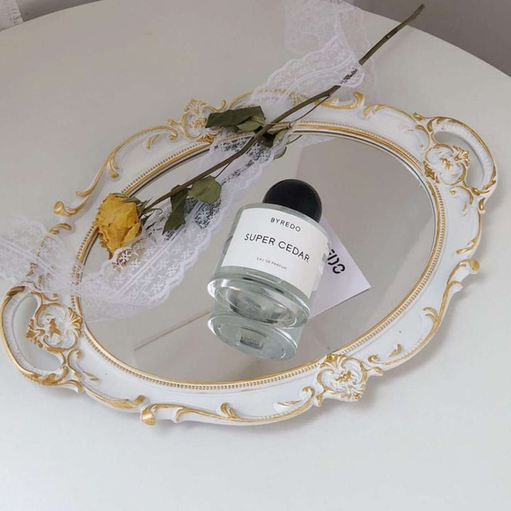 VibeCore Round Royal Mirror Tray in Silver with Gold Edges, featuring perfume, highlighting its elegant resin-crafted design. Ideal for organizing perfumes, jewelry, or decor, adding a refined European touch to any surface.