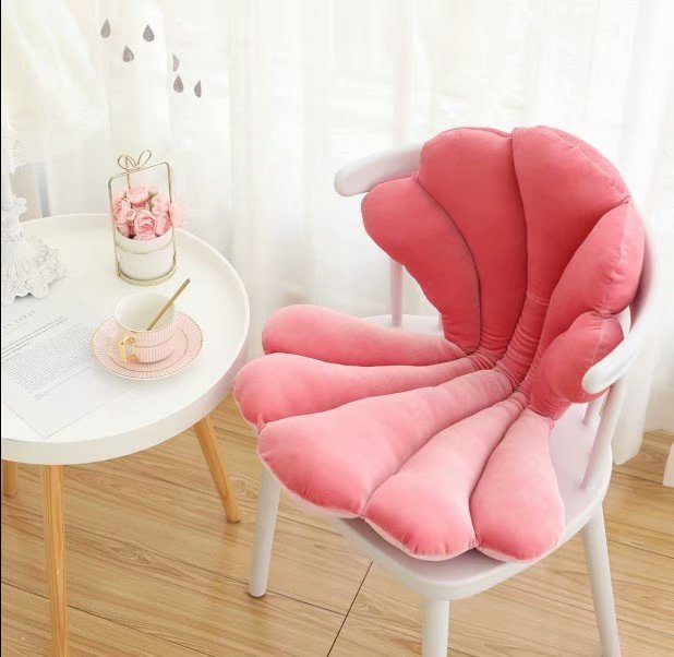 VibeCore Seashell Seat Cushion in Pink. Featuring a cute seashell shape, this cushion is made with soft velvet plush fabric and filled with PP cotton for ultimate comfort. Perfect for adding a playful, coastal-inspired touch to your space.