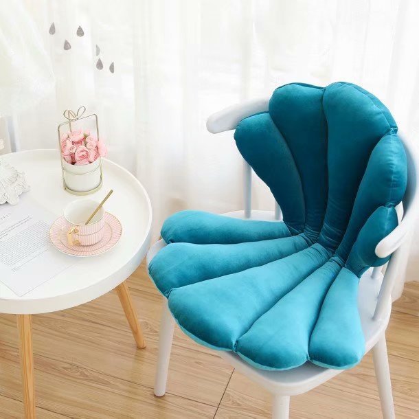 VibeCore Seashell Seat Cushion in Teal. Designed with a charming seashell shape, this cushion is made from soft velvet plush fabric and filled with PP cotton for superior comfort. Ideal for adding a coastal, playful vibe to any chair or seat.