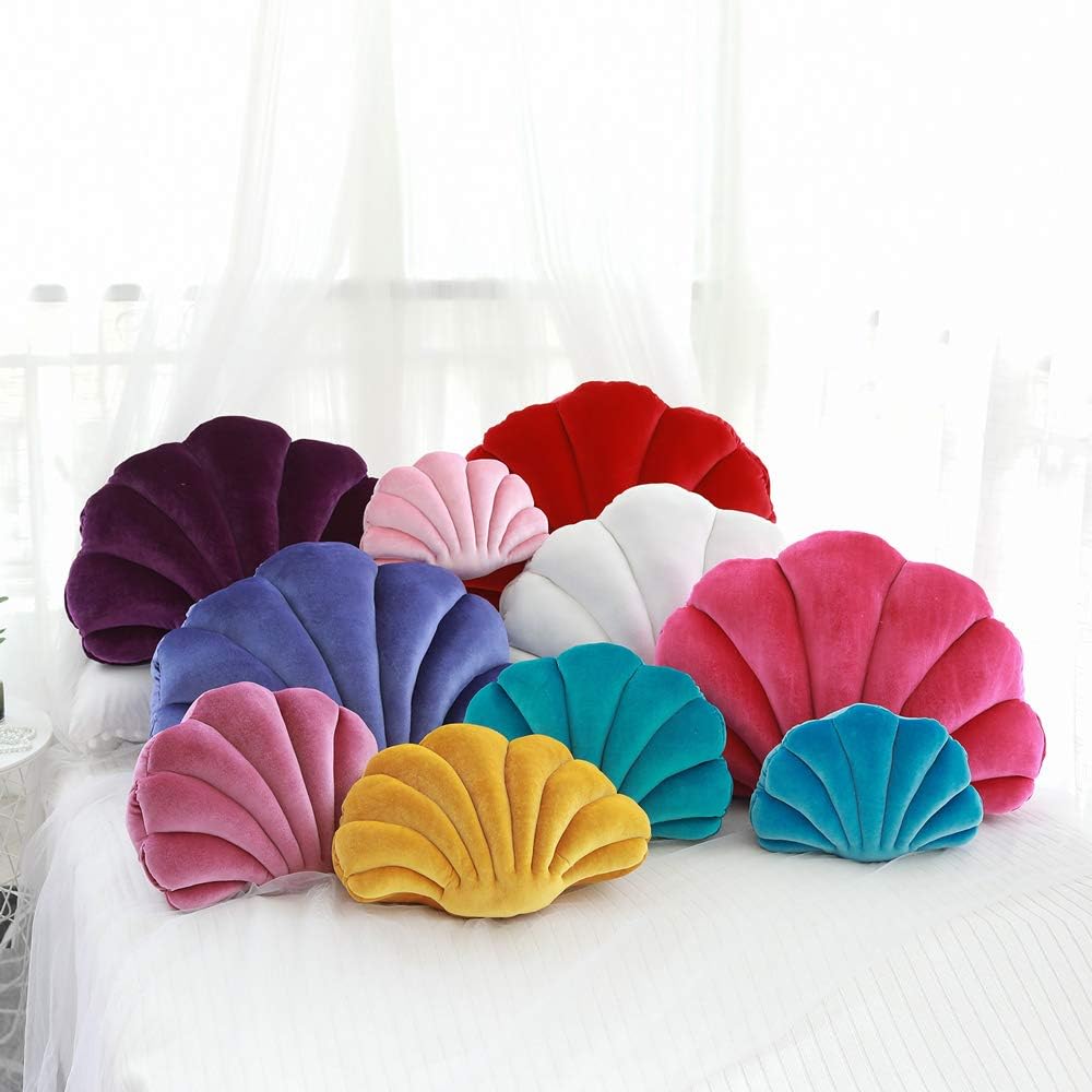 Velvet seashell throw pillow in blue, pink, white, and more, displayed in all sizes. Plush, ocean-inspired accent cushion for coastal, preppy, or aesthetic decor, adding a soft and stylish touch to any space.