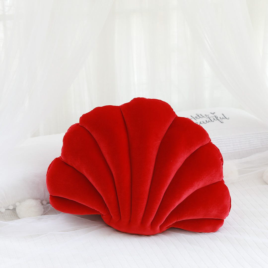 Red velvet seashell throw pillow, plush and cozy, adding a bold coastal vibe to your space. Aesthetic accent cushion perfect for vibrant room decor in bedrooms, dorms, or living areas.