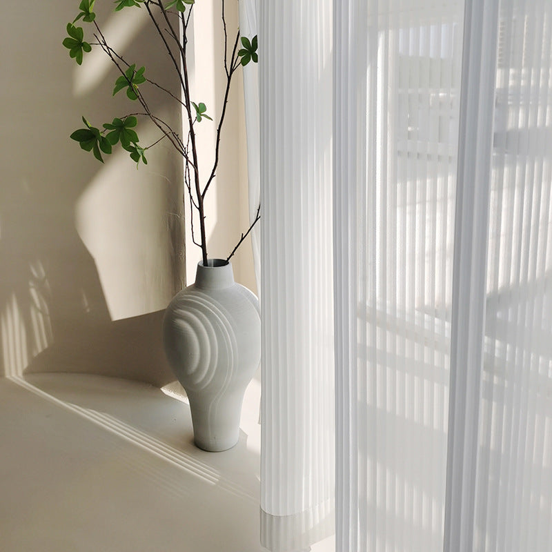 VibeCore Semi-Sheer Elegant Vertical Curtain in soft white, creating an airy, light-filled atmosphere with its minimalist design and durable, tear-resistant fabric.