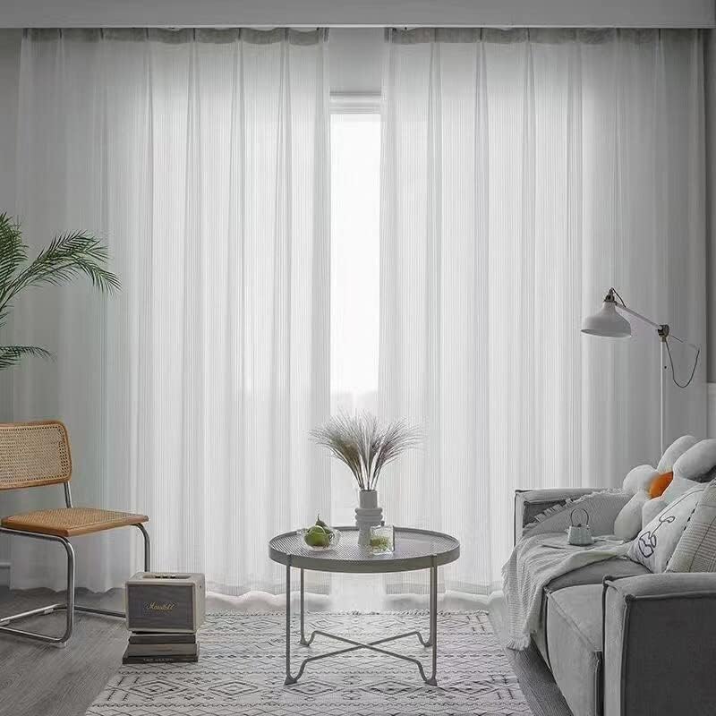 VibeCore Semi-Sheer Elegant Vertical Curtain hanging in a living room, adding a soft, airy feel with its light-filtering fabric and minimalist design.