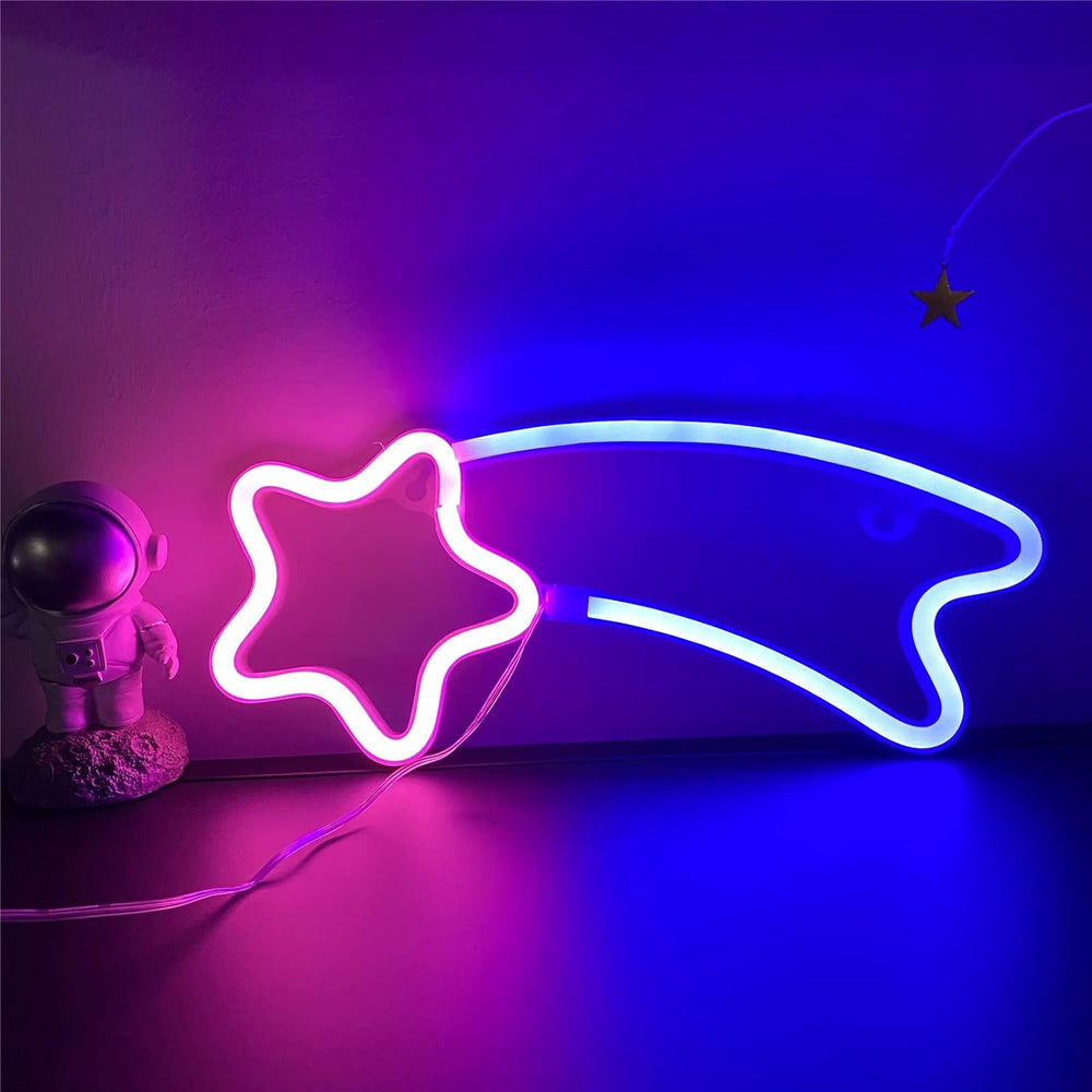 VibeCore Shooting Star Neon Light in blue and pink glowing against a wall, adding a magical, celestial vibe to the room.
