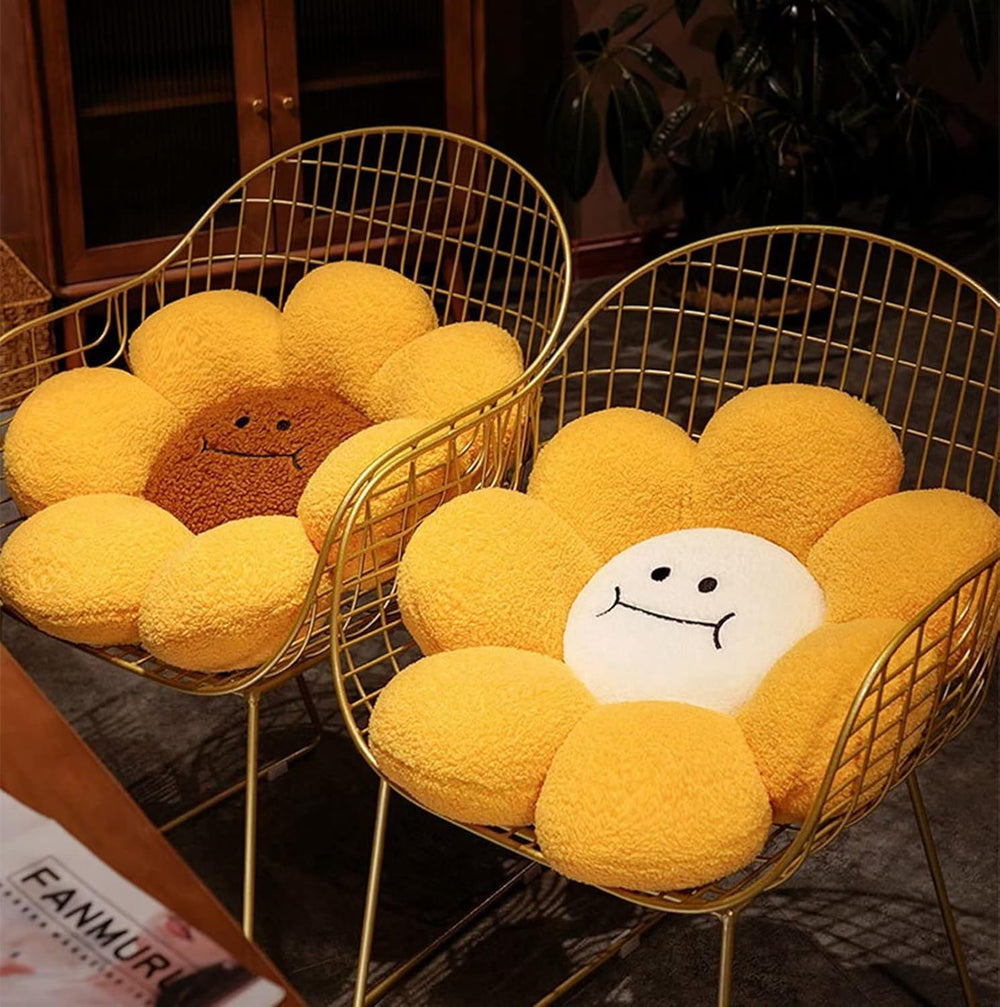 VibeCore Smiley Sunflower Throw Pillow in a chair, showcasing cheerful sunflower design and vibrant colors, adding a playful and cozy touch to any space.
