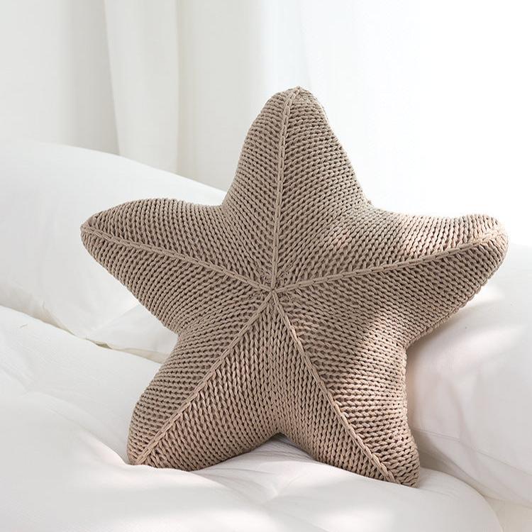 VibeCore Starfish Hand-Knitted Throw Pillow in khaki, featuring a handcrafted starfish shape and soft, cozy texture for a beachy, coastal touch.