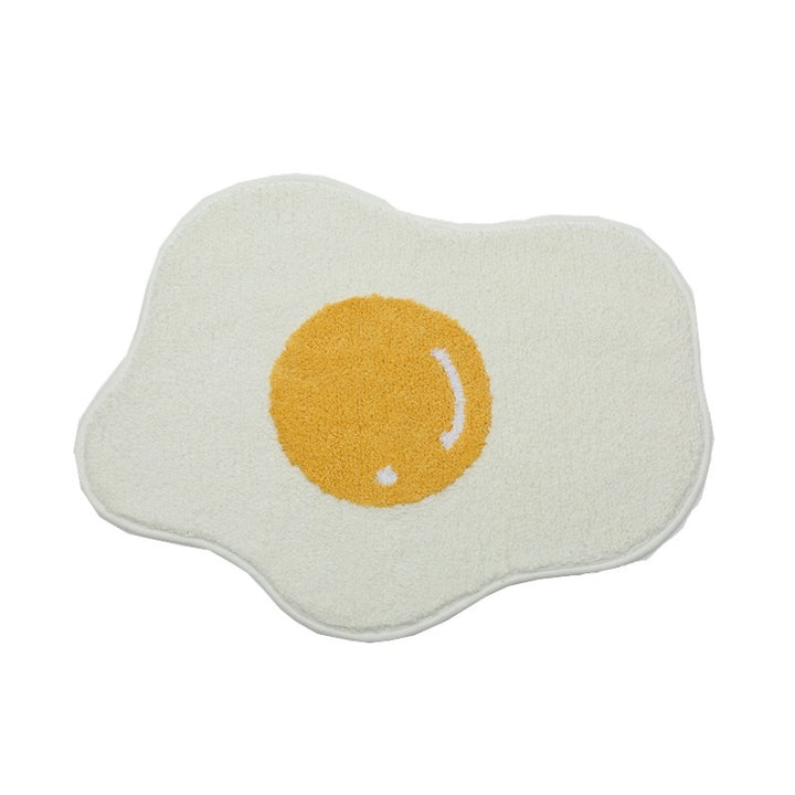 Full product view of the VibeCore Sunny-Side Up Egg Accent Rug, showcasing its playful fried egg design, soft plush texture, vibrant colors, non-slip backing, and cute rug appeal. A quirky, fun rug that adds personality and warmth to any bedroom, dorm, or living room decor.