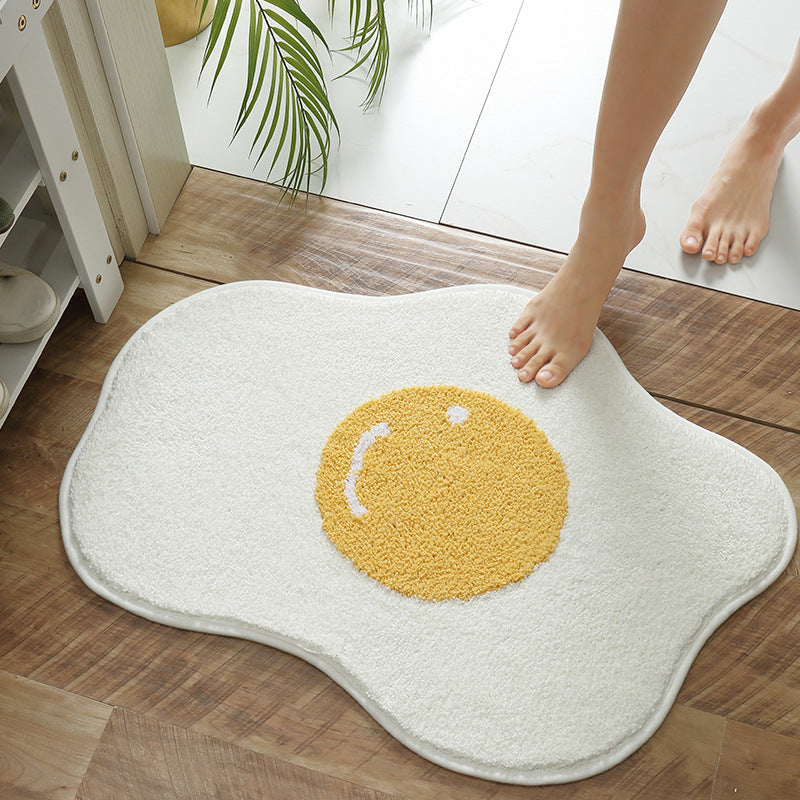 VibeCore Sunny-Side Up Egg Accent Rug with someone stepping on it, showcasing its playful fried egg design, soft plush texture, non-slip backing, and cute rug appeal. A fun, quirky addition to any bedroom, dorm, or living room decor.