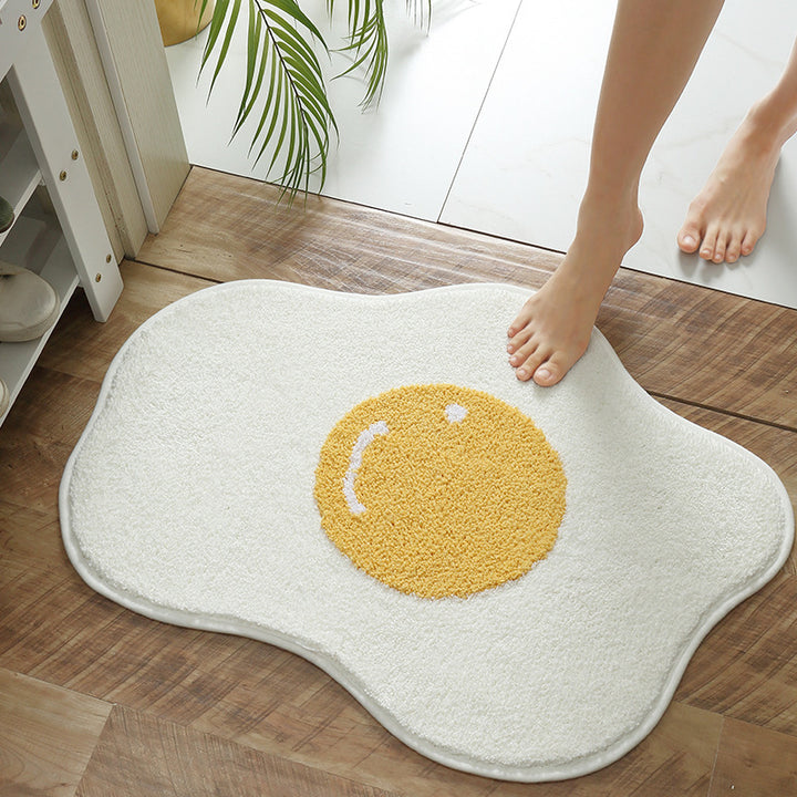 VibeCore Sunny-Side Up Egg Accent Rug with someone stepping on it, showcasing its playful fried egg design, soft plush texture, non-slip backing, and cute rug appeal. A fun, quirky addition to any bedroom, dorm, or living room decor.