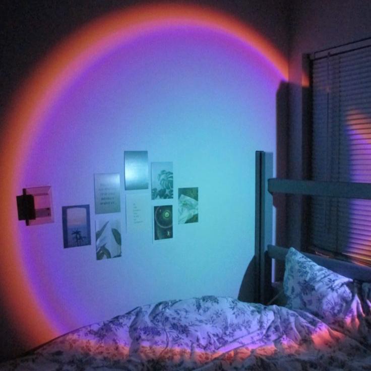 VibeCore Sunset Lamp with a blue interior and pink exterior, projecting vibrant hues on the wall, adding a calming and aesthetic touch to the room.
