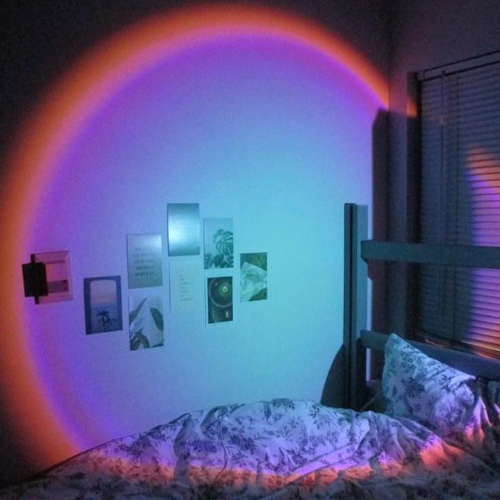 VibeCore Sunset Lamp with a blue interior and pink exterior, projecting vibrant hues on the wall, adding a calming and aesthetic touch to the room.