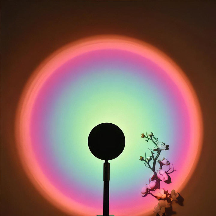VibeCore Sunset Lamp with a green interior and pink exterior, projecting a vibrant, dreamy light on the wall, perfect for creating a cozy and aesthetic atmosphere.