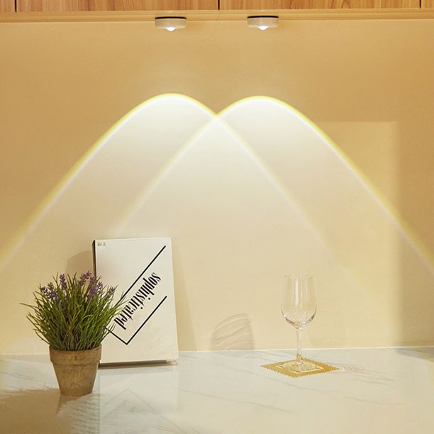 VibeCore Sunset Puck Light in white, two lights installed under a cabinet for soft, ambient illumination.