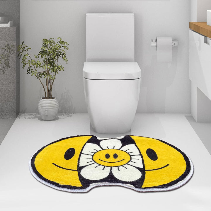 VibeCore Sunshine Split Smiley Accent Rug in a bathroom, showcasing a cheerful smiley face design that splits open to reveal a vibrant sunflower, brightening the space.