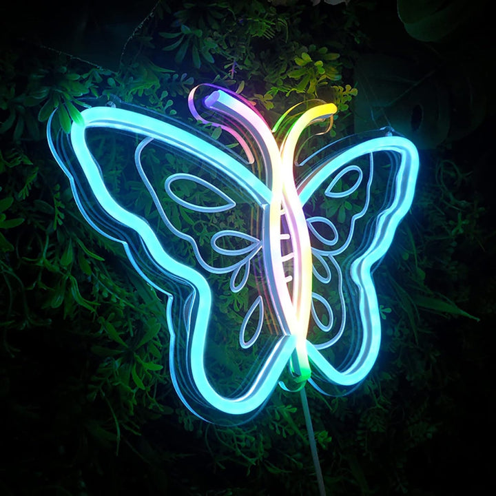 VibeCore Sweet Butterfly Neon Light Ice Blue With Boxwood Behind It