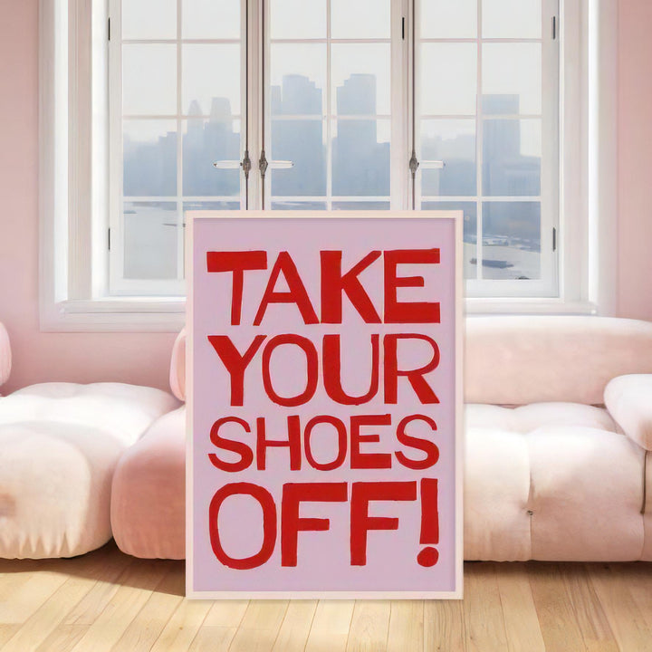 VibeCore Take Your Shoes Off Canvas Poster framed on the living room wall. The playful typography and vibrant design add a fun and funky touch to the room, creating an inviting and eclectic atmosphere in the space.