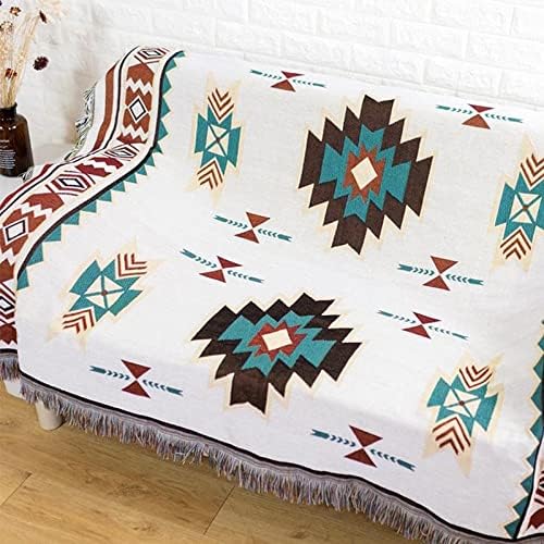VibeCore Terra Medallion Woven Blanket draped over a couch, showcasing its earthy medallion pattern and reversible design, adding a bohemian touch to the living space.