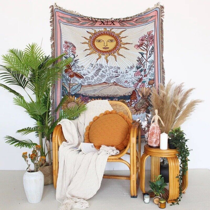 VibeCore The Sun Tarot Woven Blanket as wall hanging, featuring a celestial-inspired design with vibrant, reversible patterns. Made from soft, breathable 100% combed cotton, it adds a cosmic touch and instantly transforms your space with its unique, eye-catching aesthetic.
