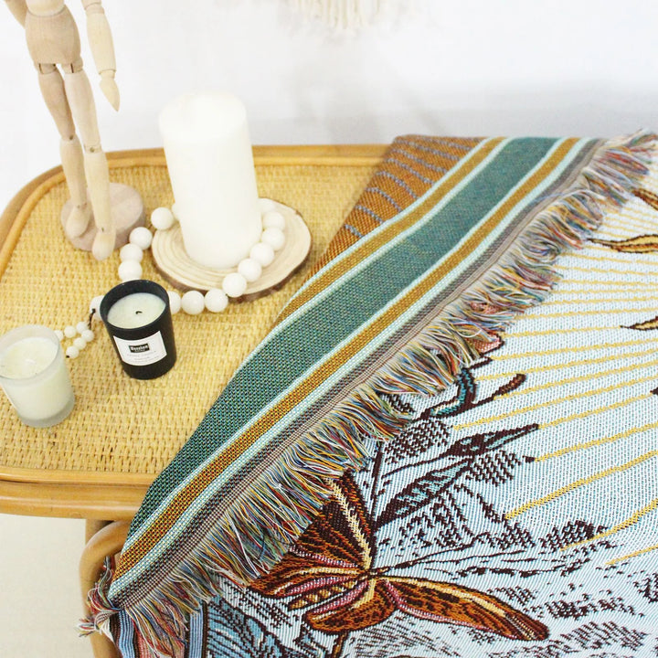 VibeCore The Sun Tarot Woven Blanket reversible design, showcasing vibrant, celestial-inspired patterns on both sides. Crafted from soft, breathable 100% combed cotton, it offers two unique looks in one blanket, allowing you to easily switch up your space with minimal effort.