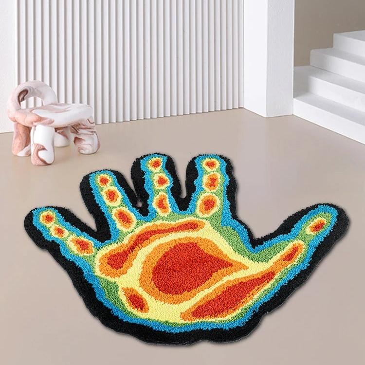 Aerial view of the "Thermal Hand Accent Rug," displaying its striking thermal-inspired hand design and bold color gradient. The rug's plush texture and high-quality detailing add a unique touch to any space.