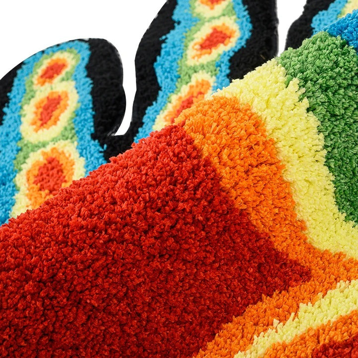 Close-up view of the "Thermal Hand Accent Rug" material, highlighting its soft, plush texture and vibrant thermal-inspired design. The detailed shot showcases the high-quality fibers and rich color gradient.