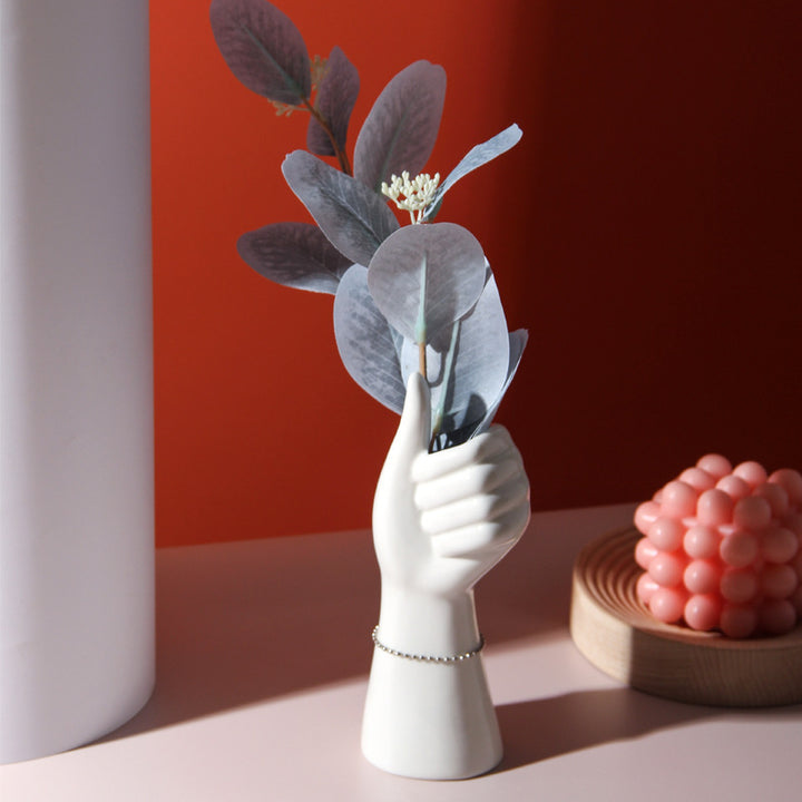 VibeCore Thumbs Up Ceramic Vase Option A – A unique hand-shaped ceramic vase made from high-quality porcelain, offering a modern twist to classic decor with its sleek glazed finish. Perfect for any room.