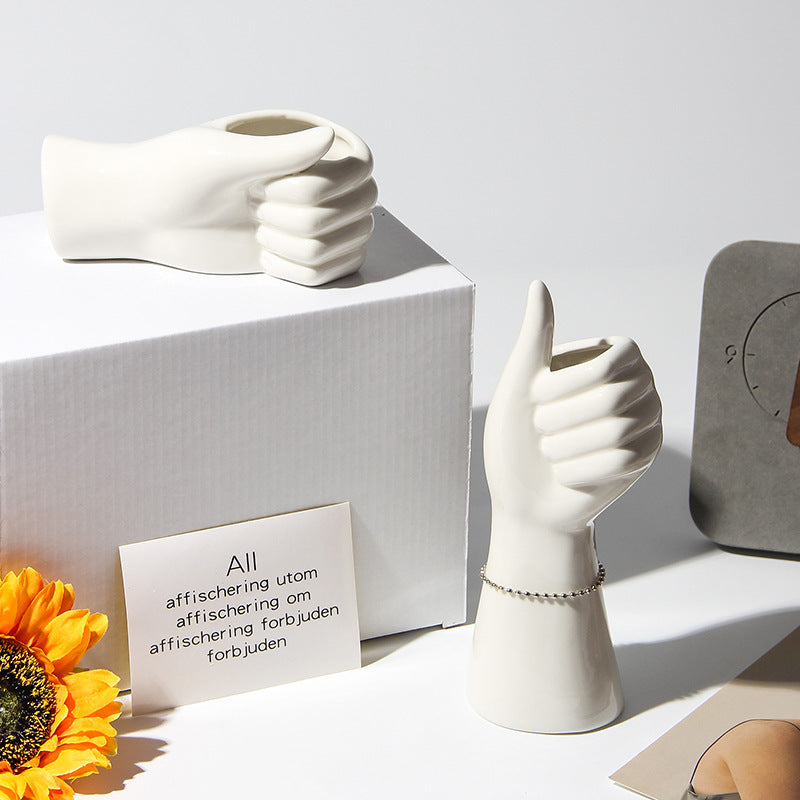 VibeCore Thumbs Up Ceramic Vase Option A and B – Two unique hand-shaped ceramic vases crafted from high-quality porcelain, featuring a sleek glazed finish. Ideal for adding modern elegance and charm to any space.