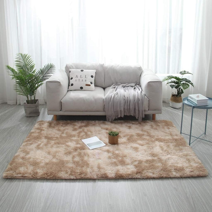 VibeCore Tie-Dye Area Rug Camel on living room floor, soft polyester fiber rug with vibrant camel tie-dye pattern, non-slip backing for safety, perfect for modern living room decor.