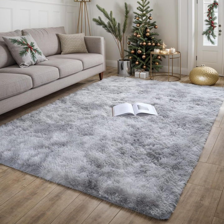 VibeCore Tie-Dye Area Rug Light Gray on living room floor, soft polyester fiber rug with vibrant light gray tie-dye pattern, non-slip backing for safety, perfect for modern living room decor.
