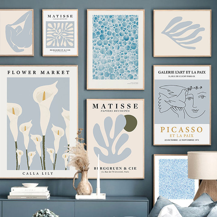 VibeCore Timeless Blue Canvas Posters wall collage featuring pastel blue abstract prints inspired by Matisse, Picasso, and vibrant flower markets. These modern art posters bring a serene and artistic atmosphere to any bedroom or dorm.